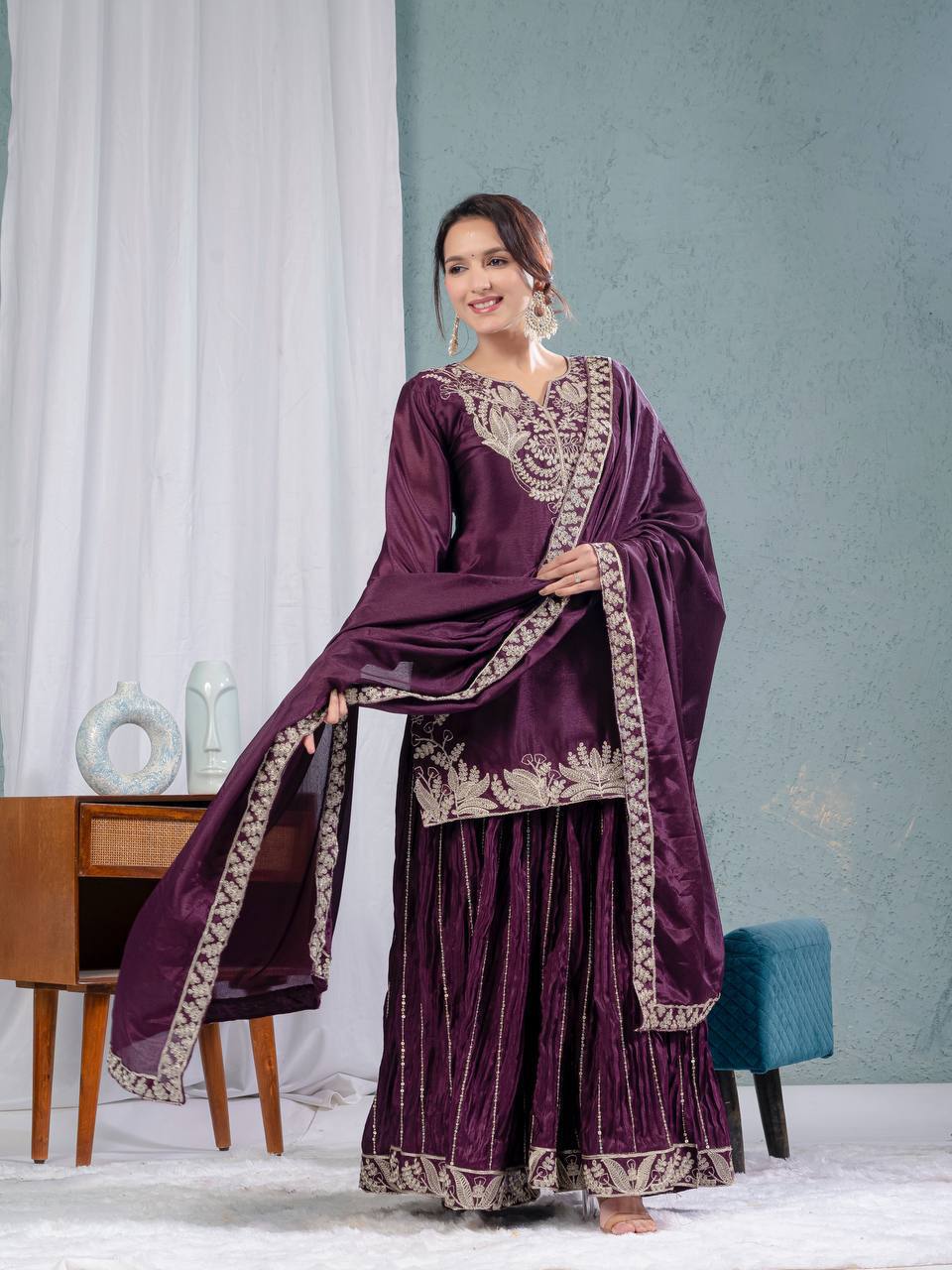 Luxurious outfit with golden accents and floral embroidery