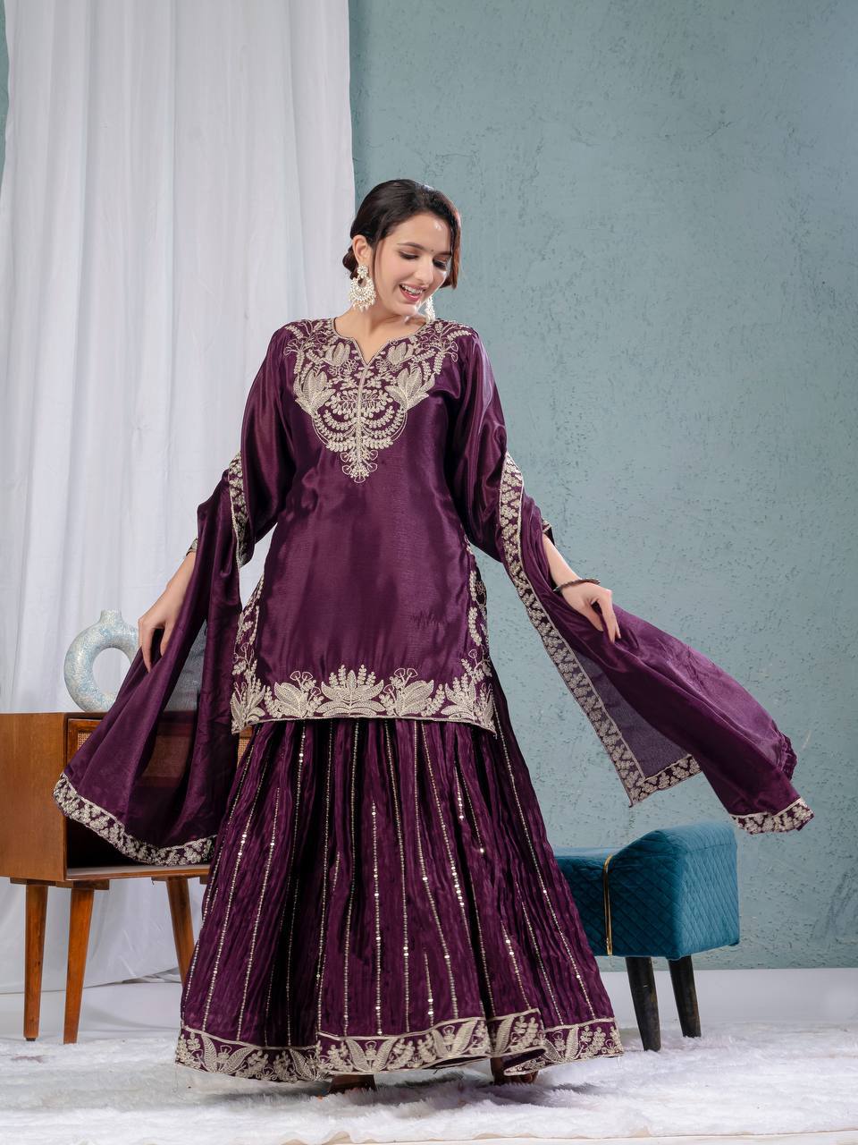 Luxurious outfit with golden accents and floral embroidery