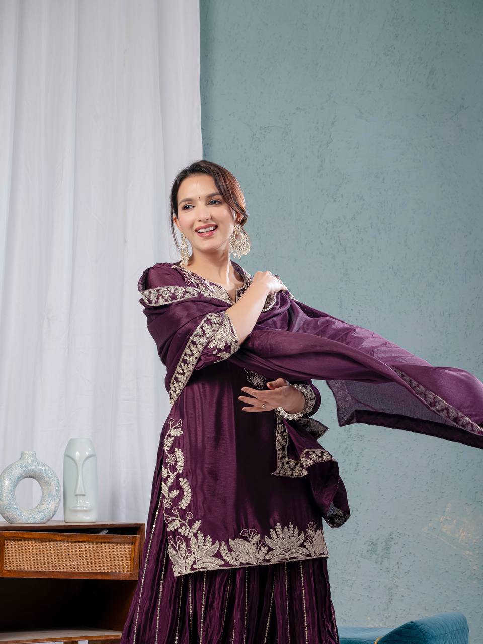 Luxurious outfit with golden accents and floral embroidery
