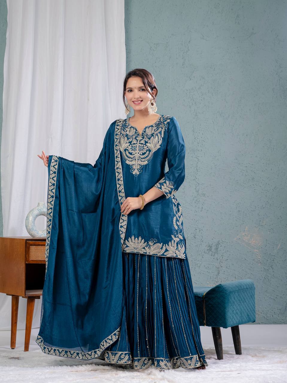 Luxurious outfit with golden accents and floral embroidery