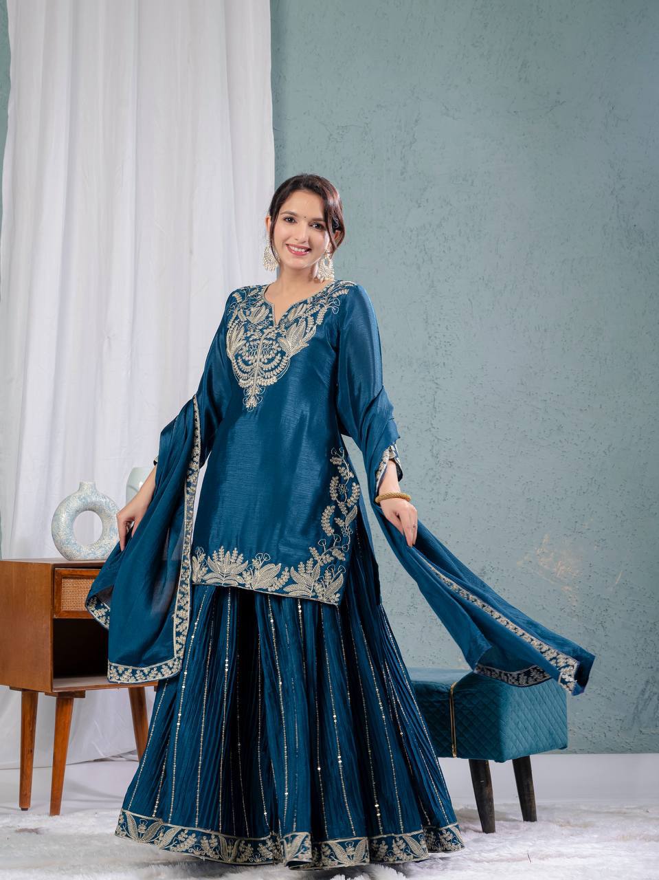 Luxurious outfit with golden accents and floral embroidery