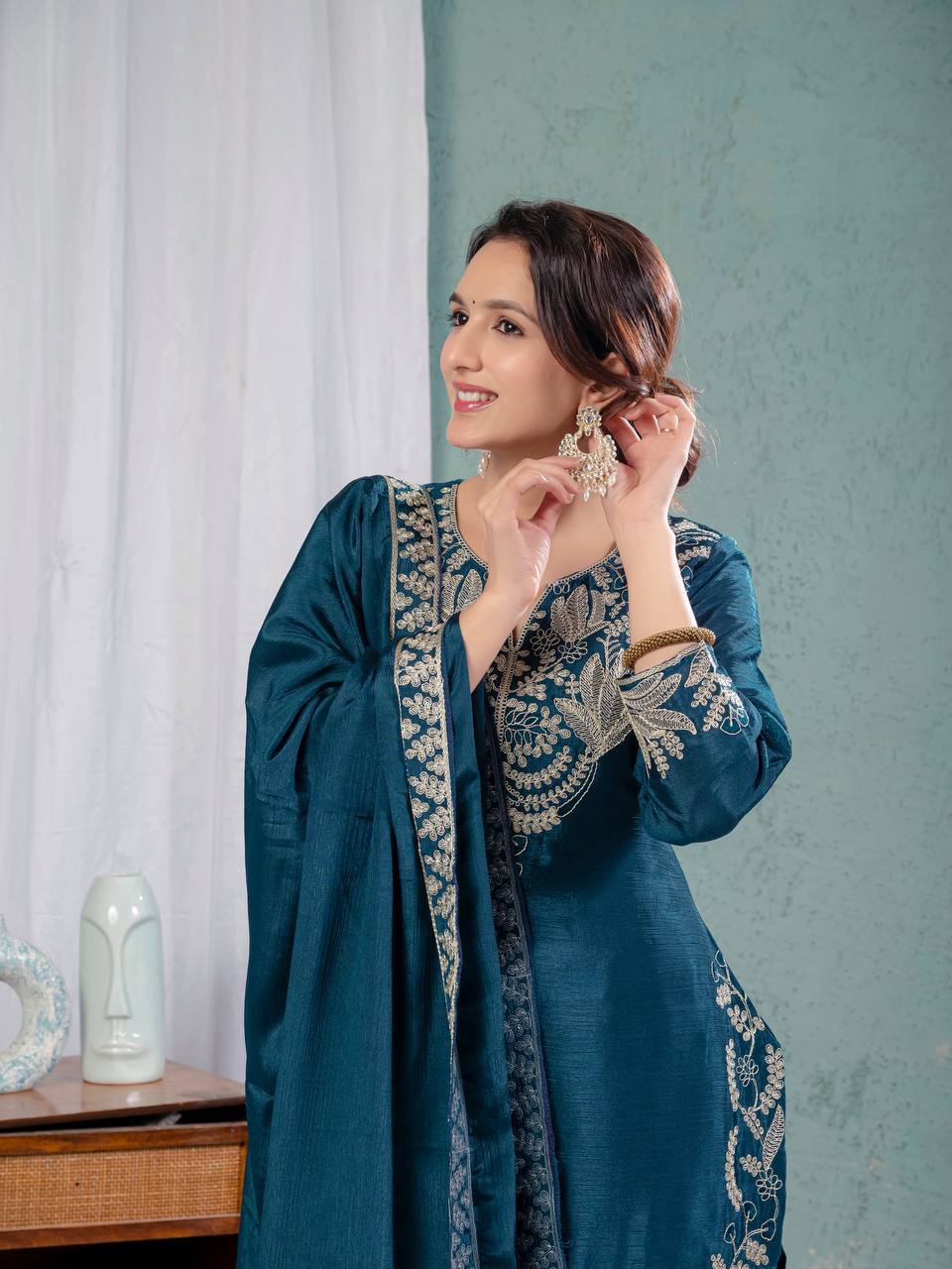 Luxurious outfit with golden accents and floral embroidery
