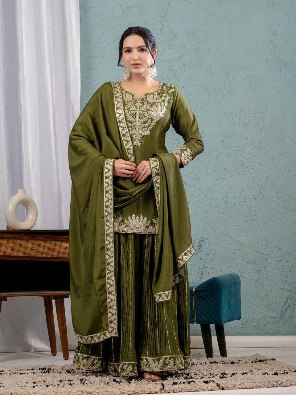 Luxurious outfit with golden accents and floral embroidery