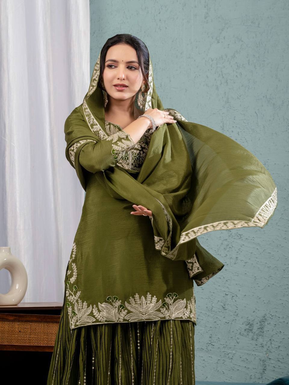 Luxurious outfit with golden accents and floral embroidery