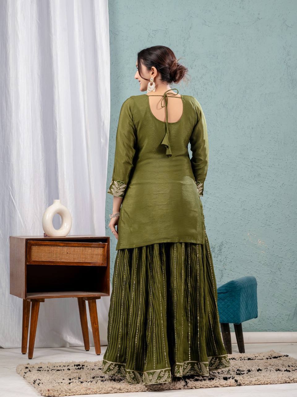 Luxurious outfit with golden accents and floral embroidery
