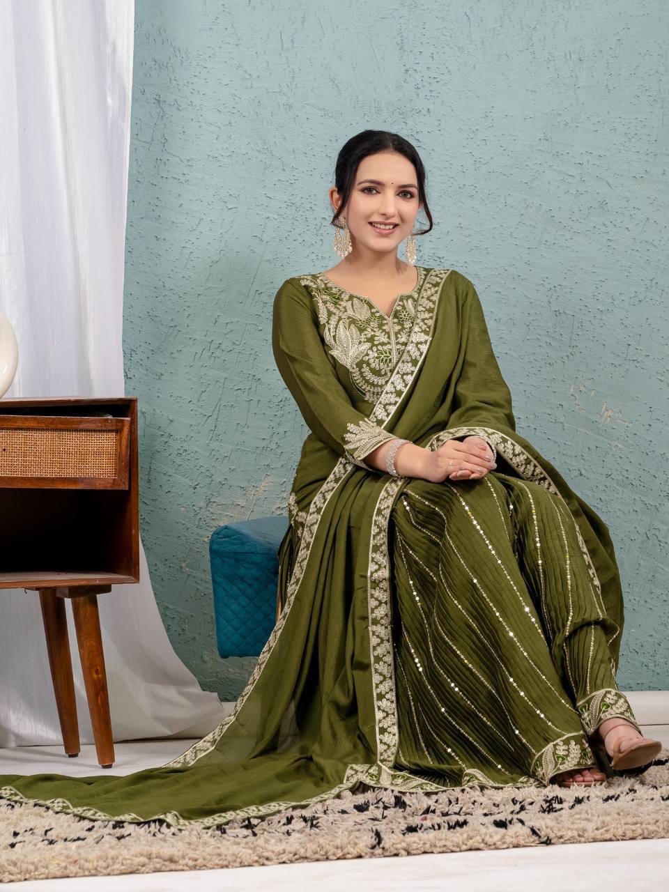 Luxurious outfit with golden accents and floral embroidery