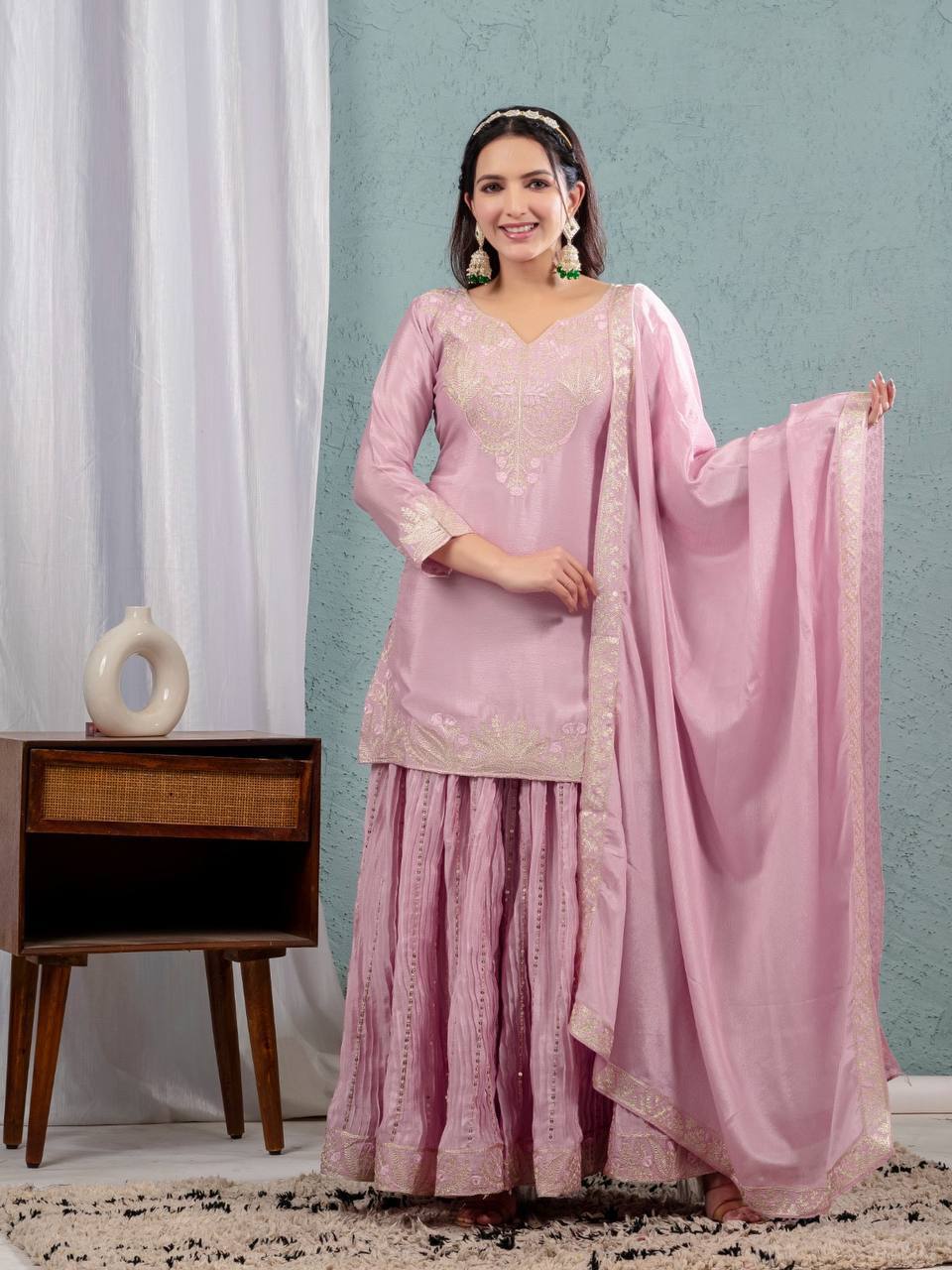 Luxurious outfit with golden accents and floral embroidery