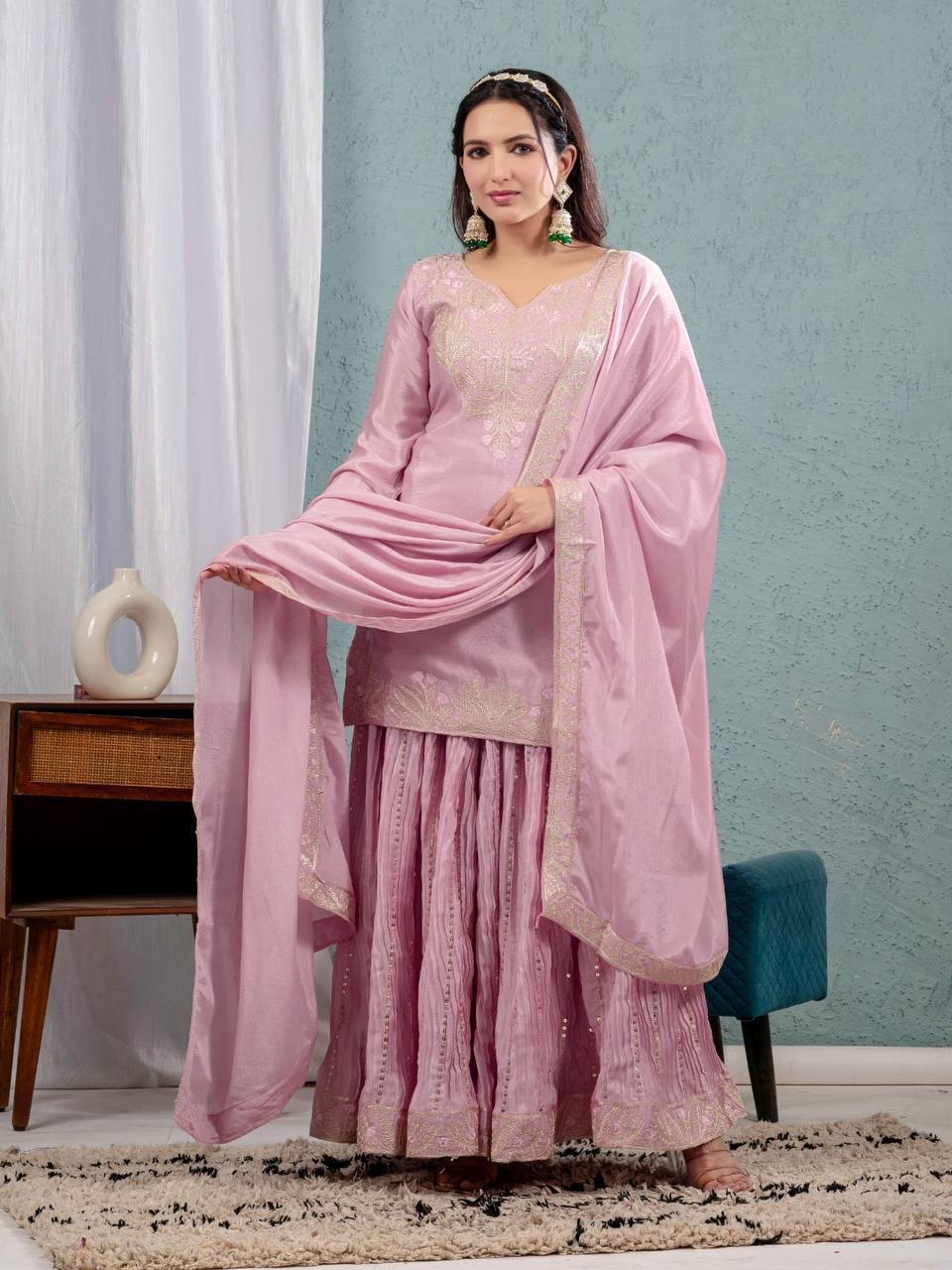 Luxurious outfit with golden accents and floral embroidery