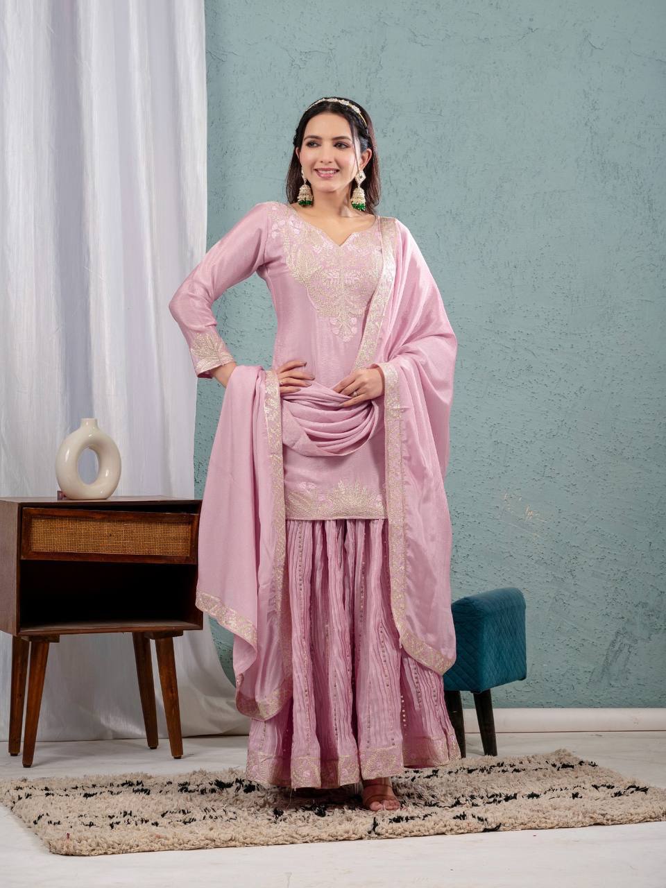 Luxurious outfit with golden accents and floral embroidery