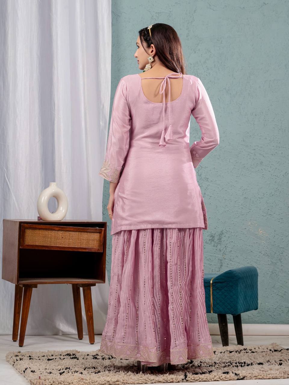 Luxurious outfit with golden accents and floral embroidery